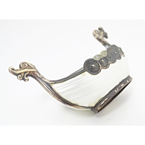 362 - Scandinavian silver: A .925 Norwegian silver salt modelled as a Viking long boat with clear glass li... 