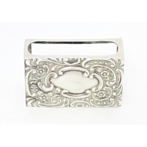 372 - A silver matchbox cover / sleeve with embossed decoration, hallmarked Birmingham 1907, maker Crisfor... 