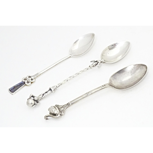 382 - Three assorted silver teaspoons one marked sterling with abalone shell detail to handle, one swan fi... 