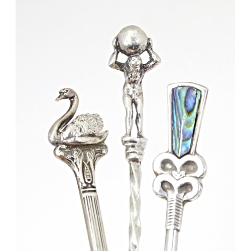 382 - Three assorted silver teaspoons one marked sterling with abalone shell detail to handle, one swan fi... 