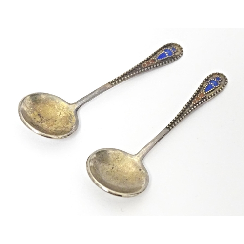 390 - A pair of Russian small silver salt spoons with enamel decoration. Approx. 2