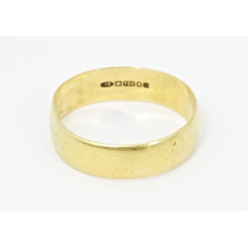 609 - An 18ct gold ring. Ring size approx. T