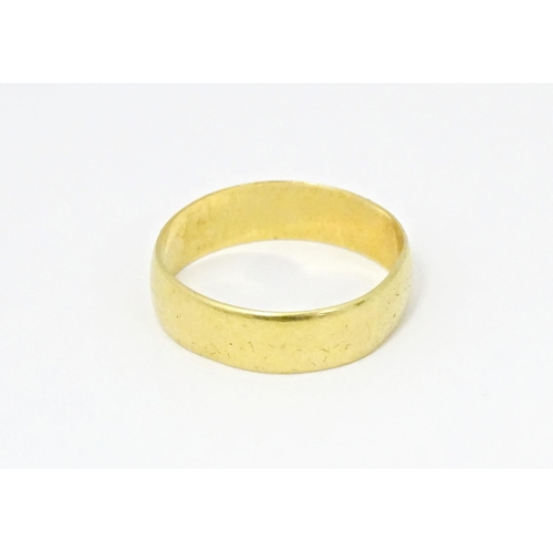 609 - An 18ct gold ring. Ring size approx. T