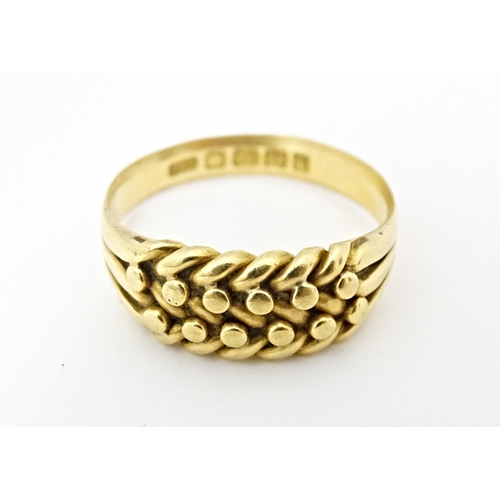 611 - An 18ct gold ring. Ring size approx. U