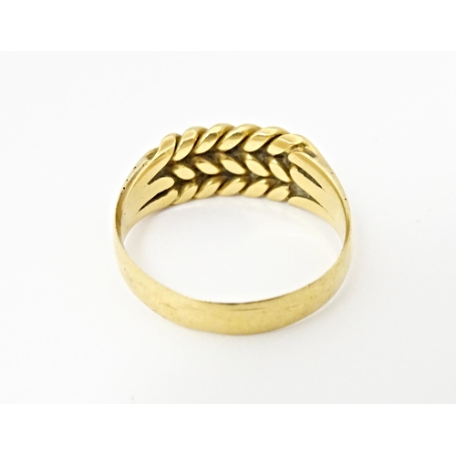 611 - An 18ct gold ring. Ring size approx. U