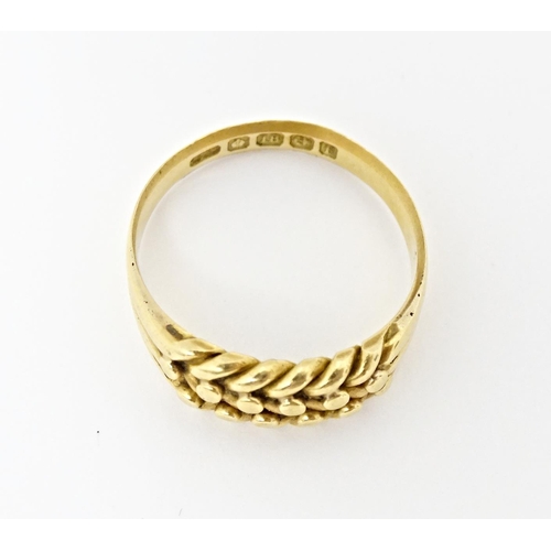 611 - An 18ct gold ring. Ring size approx. U