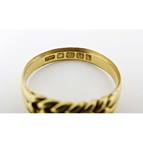 611 - An 18ct gold ring. Ring size approx. U