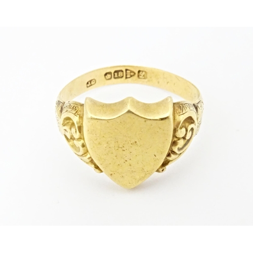 612 - An 18ct gold signet ring hallmarked Chester 1911. Ring size approx. T