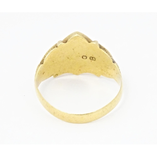 612 - An 18ct gold signet ring hallmarked Chester 1911. Ring size approx. T