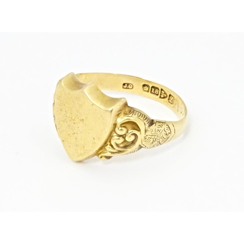 612 - An 18ct gold signet ring hallmarked Chester 1911. Ring size approx. T