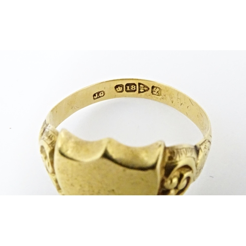 612 - An 18ct gold signet ring hallmarked Chester 1911. Ring size approx. T