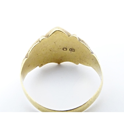 612 - An 18ct gold signet ring hallmarked Chester 1911. Ring size approx. T