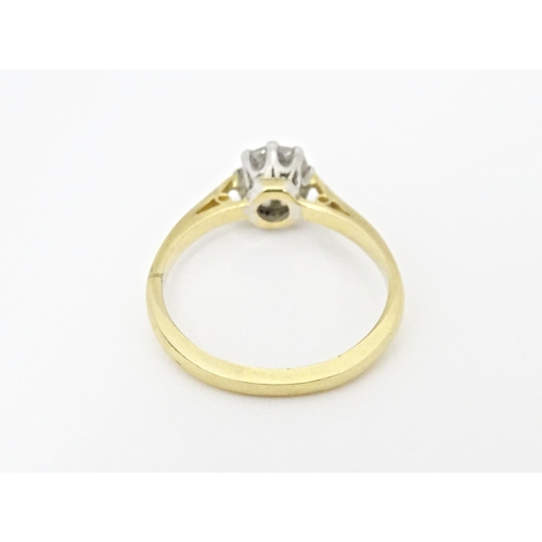 615 - An 18ct gold diamond solitaire ring. Diamond approx. 5mm wide. Ring size approx. J