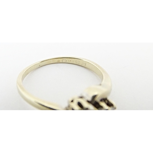 616 - An 18ct gold ring set with three diamonds. Ring size approx. L