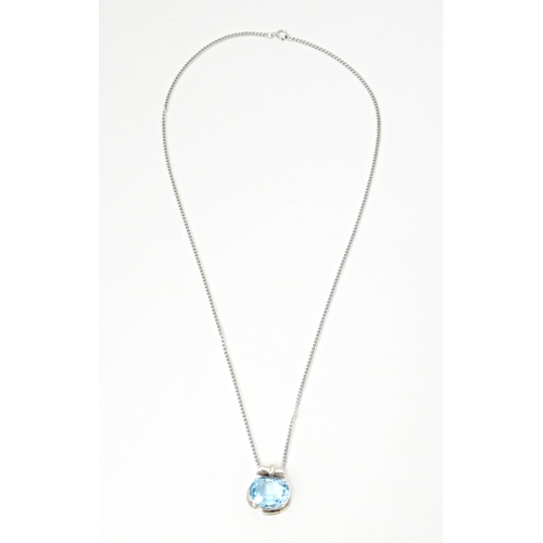 707 - A. 925 silver pendant and chain, the pendant set with topaz. The pendant  3/4