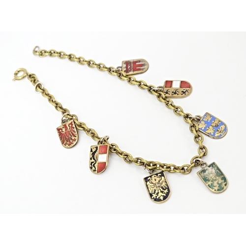 709 - Two Continental gilt metal souvenir bracelets with enamel detail , one titled Wien. Approx 7 1/2