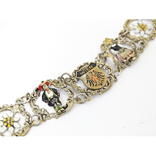 709 - Two Continental gilt metal souvenir bracelets with enamel detail , one titled Wien. Approx 7 1/2