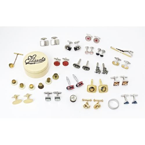 711 - A quantity of assorted cufflinks, studs, a tie clip by Dunhill, etc. Together with an ivorine box wi... 