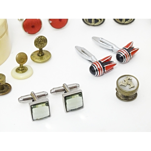 711 - A quantity of assorted cufflinks, studs, a tie clip by Dunhill, etc. Together with an ivorine box wi... 