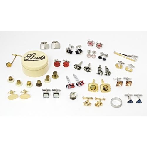 711 - A quantity of assorted cufflinks, studs, a tie clip by Dunhill, etc. Together with an ivorine box wi... 