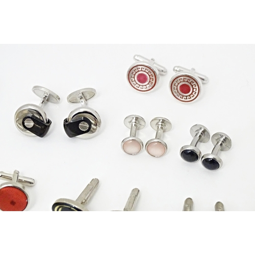 711 - A quantity of assorted cufflinks, studs, a tie clip by Dunhill, etc. Together with an ivorine box wi... 