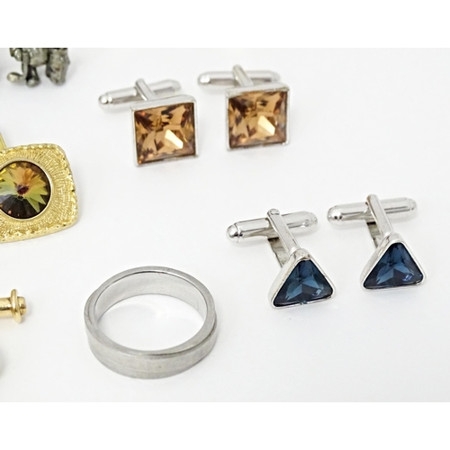 711 - A quantity of assorted cufflinks, studs, a tie clip by Dunhill, etc. Together with an ivorine box wi... 