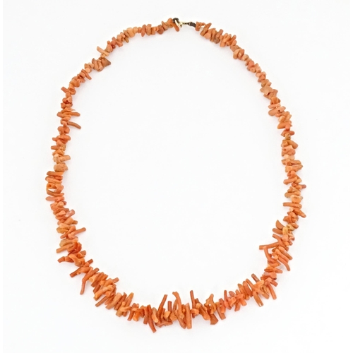 712 - A vintage coral necklace of graduated coral branch beads. Approx. 18