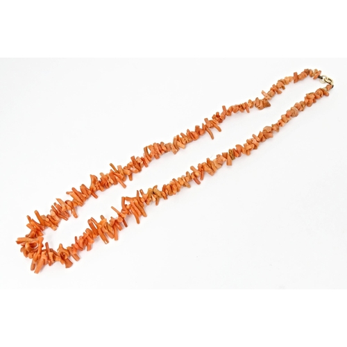 712 - A vintage coral necklace of graduated coral branch beads. Approx. 18