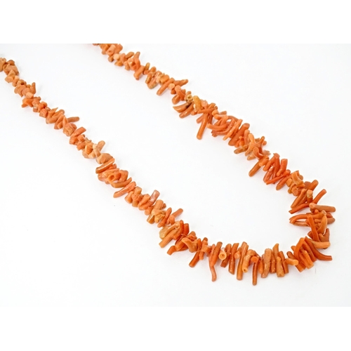 712 - A vintage coral necklace of graduated coral branch beads. Approx. 18