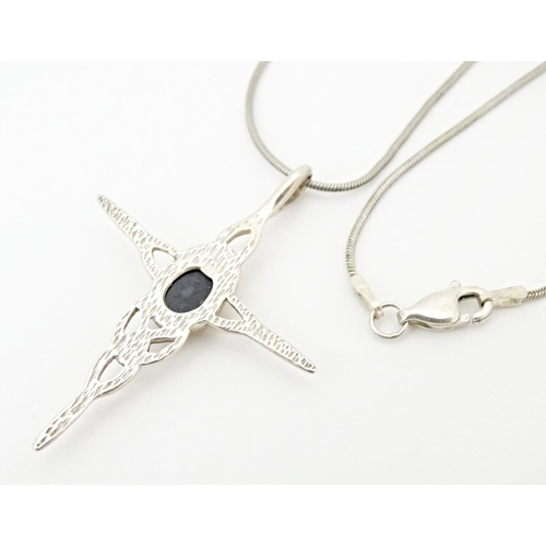 713 - Two silver pendants. Together with cross formed pendant and chain. Largest pendant approx. 2 1/2