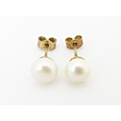 719 - A pair of pearl stud earrings