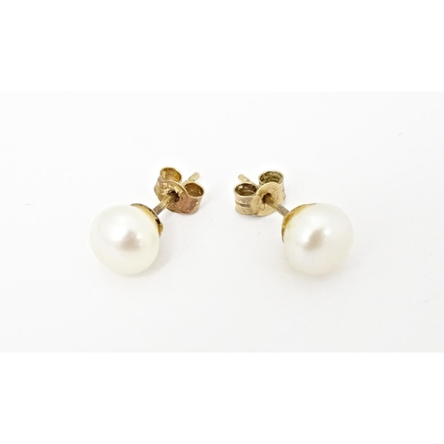 719 - A pair of pearl stud earrings