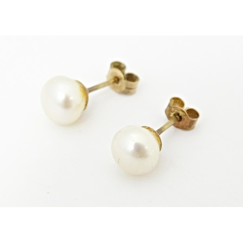 719 - A pair of pearl stud earrings