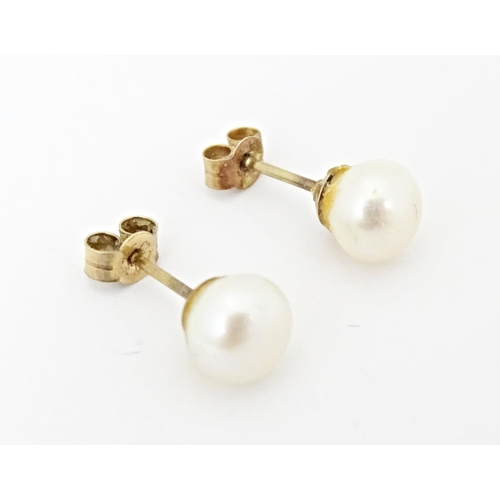 719 - A pair of pearl stud earrings