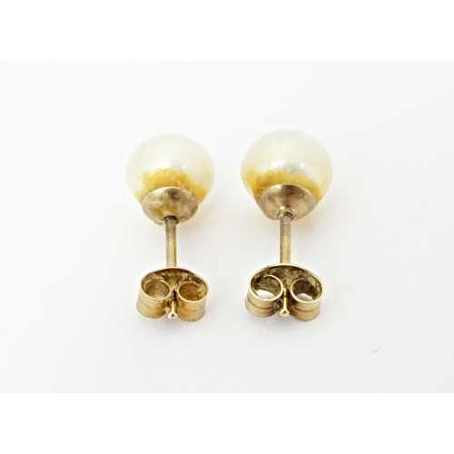 719 - A pair of pearl stud earrings