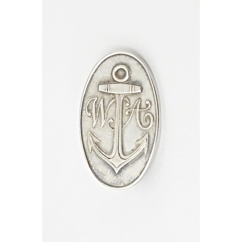 721 - A silver brooch of oval form with anchor detail and monogram WA. Hallmark Sheffield 2000. Approx 1 1... 