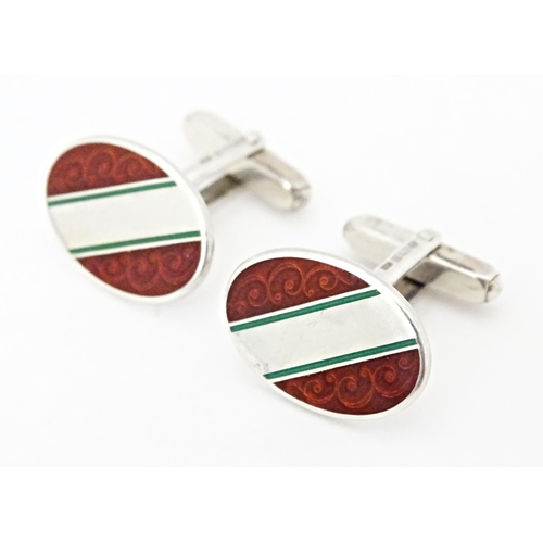 724 - Two pairs of silver cufflinks with enamel decoration. One pair hallmarked Birmingham 1950 maker E S ... 