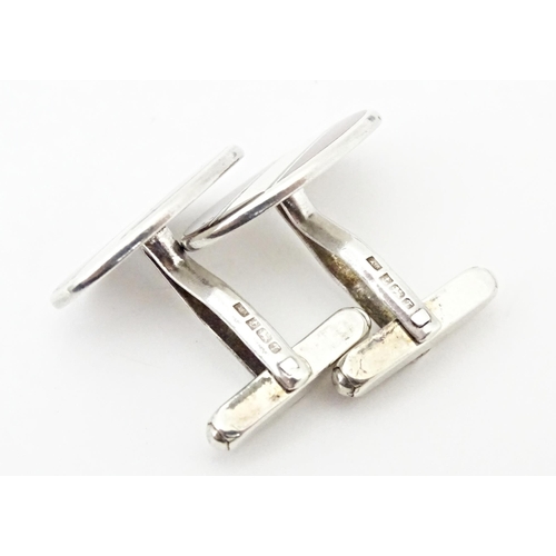 724 - Two pairs of silver cufflinks with enamel decoration. One pair hallmarked Birmingham 1950 maker E S ... 