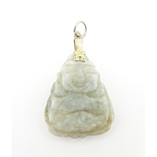 728 - An oriental carved  bowenite jade pendant approx 2