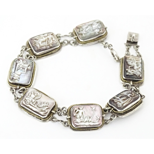 736 - A Continental .800 silver bracelet set with carved abalone shell panels depicting classical scenes. ... 