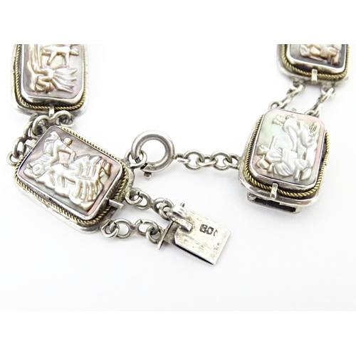 736 - A Continental .800 silver bracelet set with carved abalone shell panels depicting classical scenes. ... 