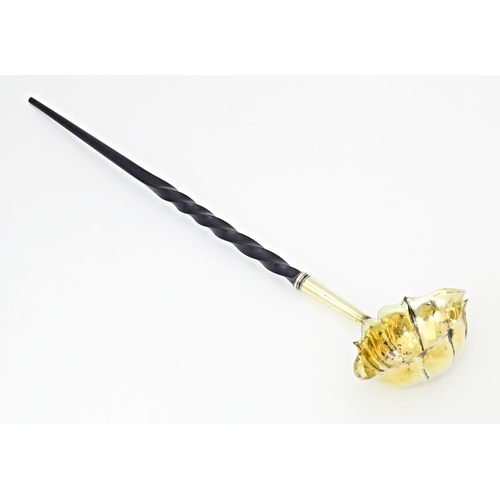 402 - A Geo II silver punch / toddy ladle with gilt bowl and whale bone handle, hallmarked London 1744. Ap... 