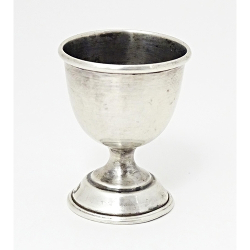 406 - A silver egg cup of pedestal form, hallmarked Birmingham 1959, maker William Adams Ltd. Approx. 2 1/... 