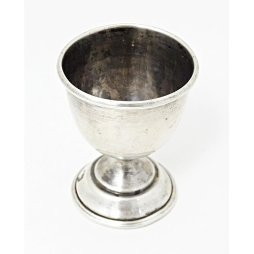 406 - A silver egg cup of pedestal form, hallmarked Birmingham 1959, maker William Adams Ltd. Approx. 2 1/... 