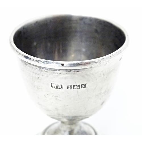 406 - A silver egg cup of pedestal form, hallmarked Birmingham 1959, maker William Adams Ltd. Approx. 2 1/... 