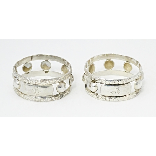 409 - A pair of South African silver napkin rings, by Joe Calafato. Marked Ster. Silv Candida (2)