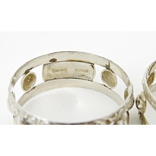 409 - A pair of South African silver napkin rings, by Joe Calafato. Marked Ster. Silv Candida (2)