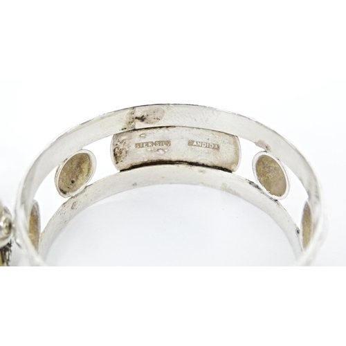 409 - A pair of South African silver napkin rings, by Joe Calafato. Marked Ster. Silv Candida (2)