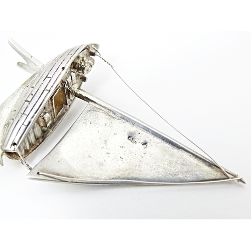 414 - A silver model of a sailing boat. Approx. 2 1/2