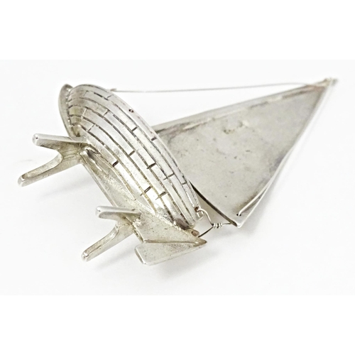 414 - A silver model of a sailing boat. Approx. 2 1/2